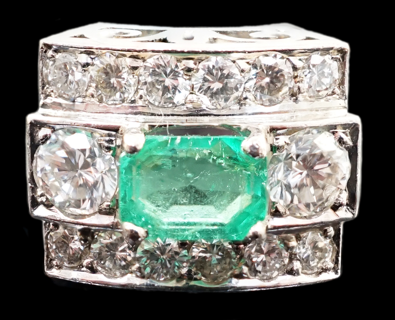 A Swedish 18k gold, single stone emerald and fourteen stone diamond set three row cluster ring